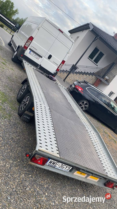Wynajem lawety usługi lawetą przewóz aut maszyn Kock