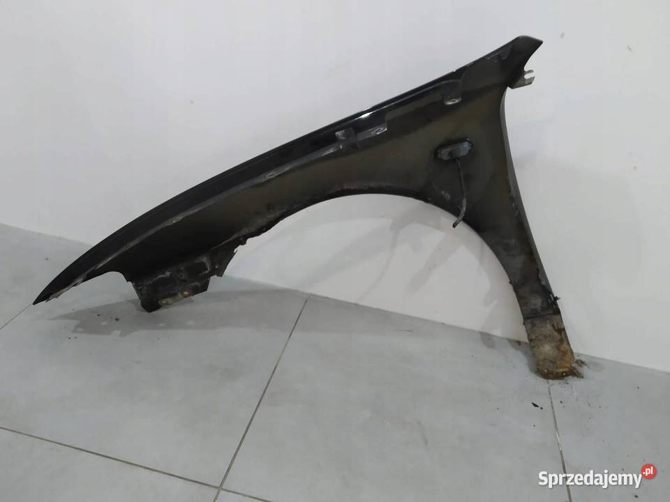 BŁOTNIK PRAWY PRZÓD CZARNY LEON I Seat Toledo II Karoseria