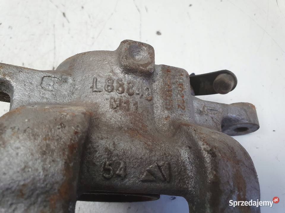 Nissan Micra K14 PRZEDNI ZACISK HAMULCOWY lewy