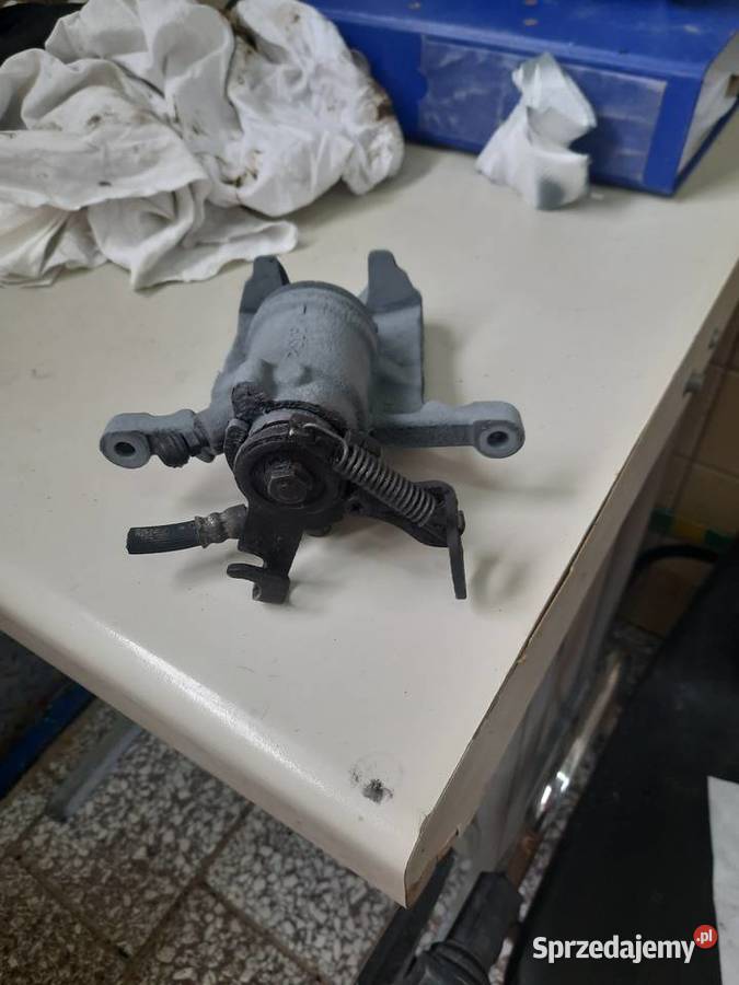 Zacisk lewy tył opel astra j Będzin