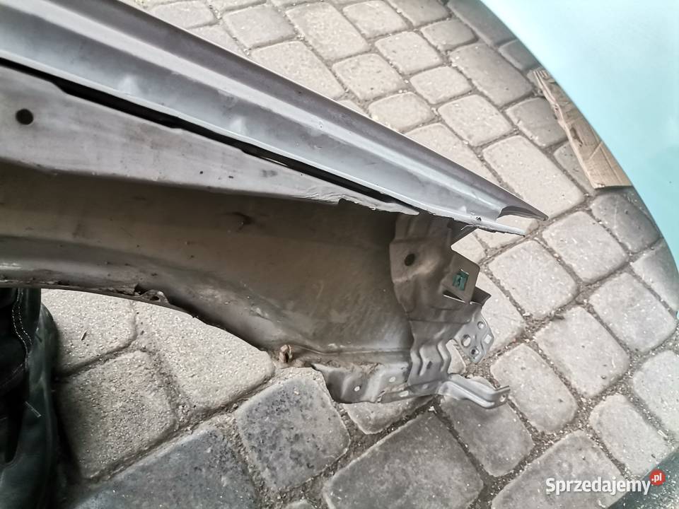 NISSAN PRIMERA P12 BŁOTNIK LEWY PRZEDNI KY0G Rok produkcji 2005 Nowy Sącz