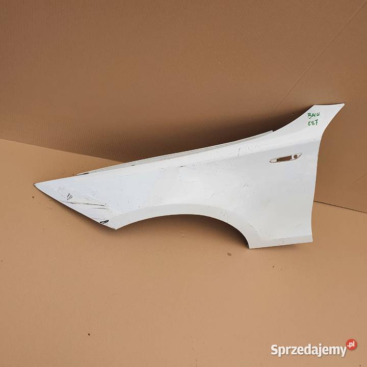 BMW 1 E87 BŁOTNIK LEWY PRZÓD Trzciel