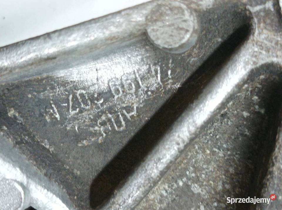 ŁAPA WSPORNIK MOCOWANIE ROLKA 074199207M 20 20 Części samochodowe