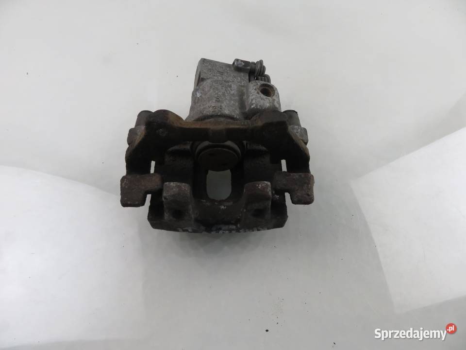 ZACISK LEWY TYŁ RENAULT GRAND ESPACE IV 20 Turbo Zaciski i jarzma małopolskie