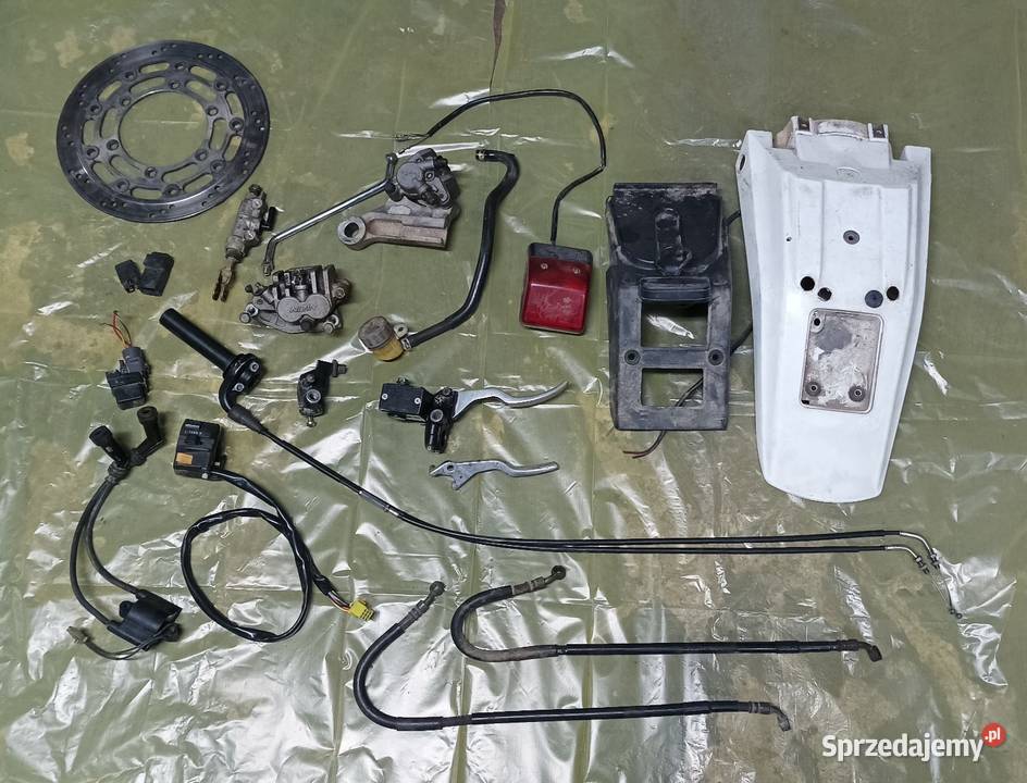 Błotnik lampa cewka WN linka rolgaz pompa zacisk Gołaczewy