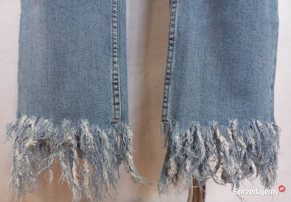Spodnie jeans Frędzle niebieskie Pióra r 38