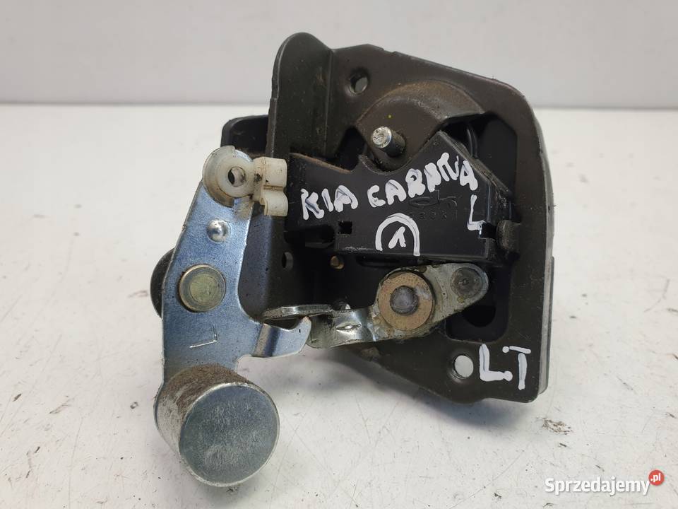 ZAMEK DRZWI lewy TYŁ Kia Carnival I TYLNY Rudka
