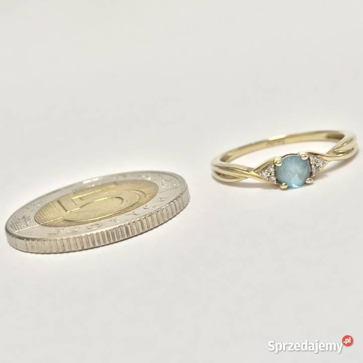Złoty pierścionek 9K 375 z błękitnym topazem i Warszawa sprzedam