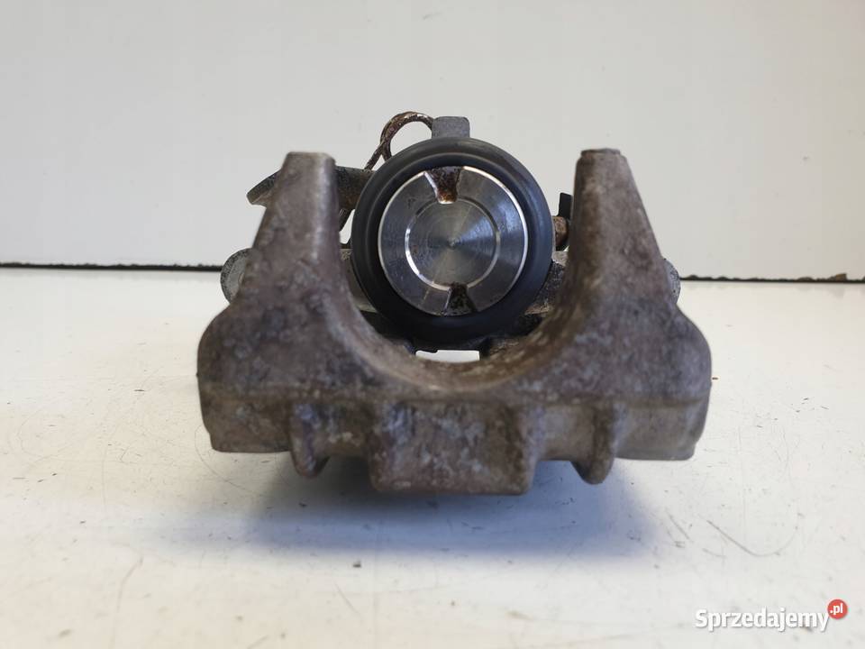 VW Golf IV LEWY ZACISK HAMULCOWY tył KIEROWCY osobowe Części samochodowe Janów