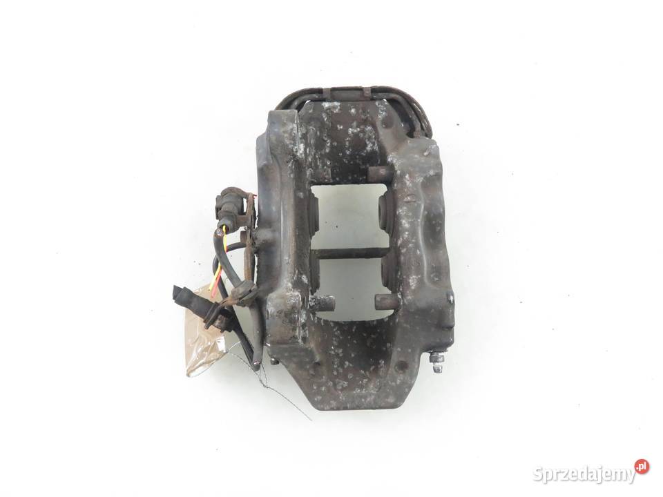 ZACISK LEWY TYŁ AUDI Q7 42 FSI 208930051A