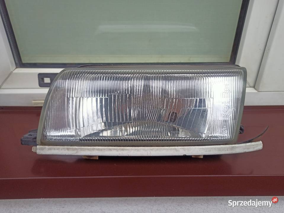 Nissan Sunny N14 lampa przednia lewa reflektor osobowe Części samochodowe Sieradz sprzedam