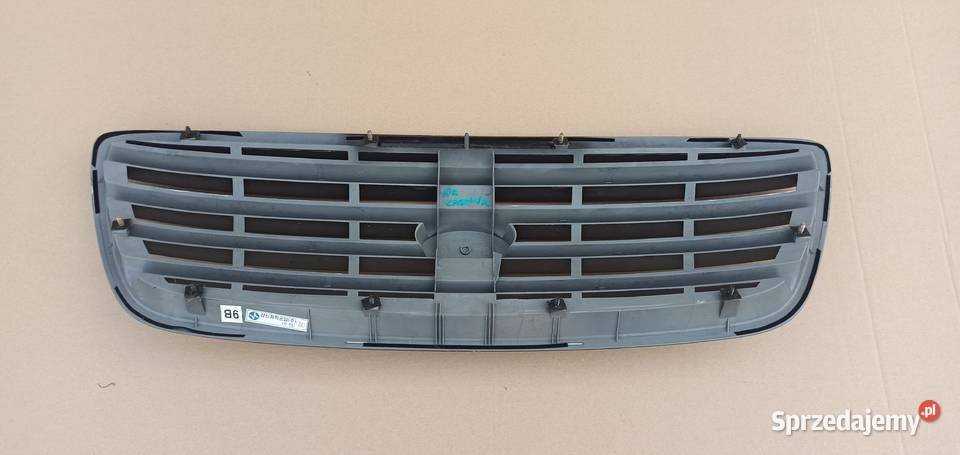 KIA CARNIVAL I GRILL ATRAPA EMBLEMAT OK53A50710 Motoryzacja Bieleń sprzedam