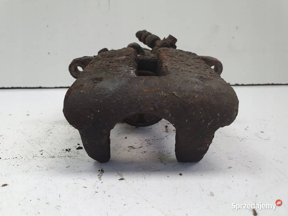 Volvo S60II XC60 TYLNY ZACISK HAMULCOWY LEWY tył Janów