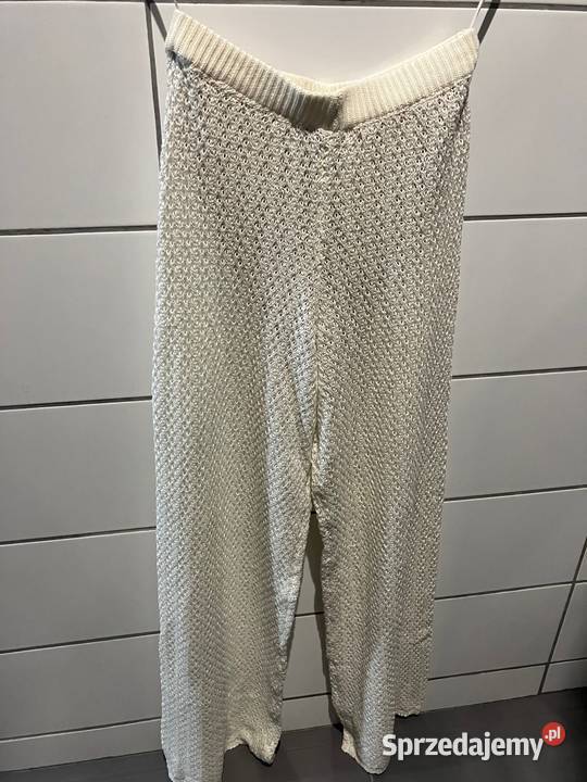 kremowe dzianinowe bawełniane spodnie xs 34 Toruń
