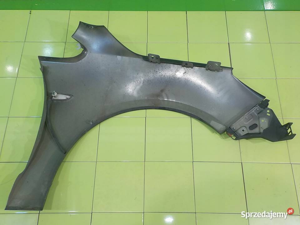 OPEL ASTRA IV J 16 B 11r 5D blotnik lewy przod Suków