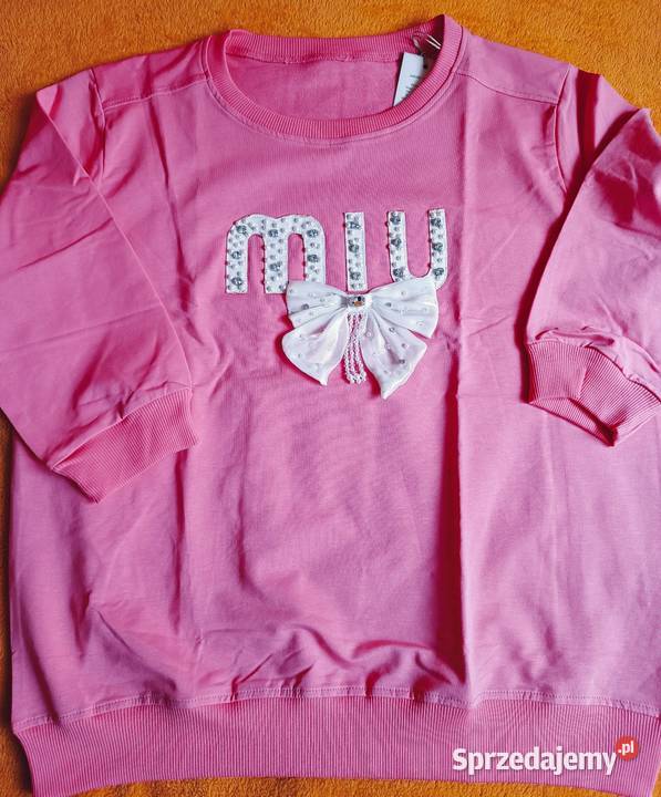 Bluza różowa z ozdobną kokardą i perełkami Cieszyn