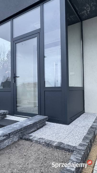 Zabudowa aluminiowa wiatrołap ganek Nowy Sącz