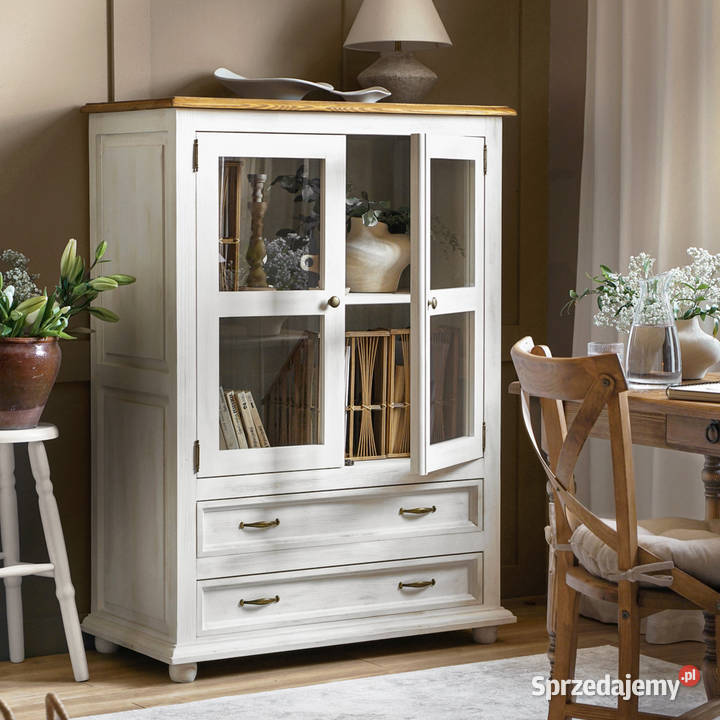 Stylowa biała komoda z przeszklonymi drzwiczkami Komody