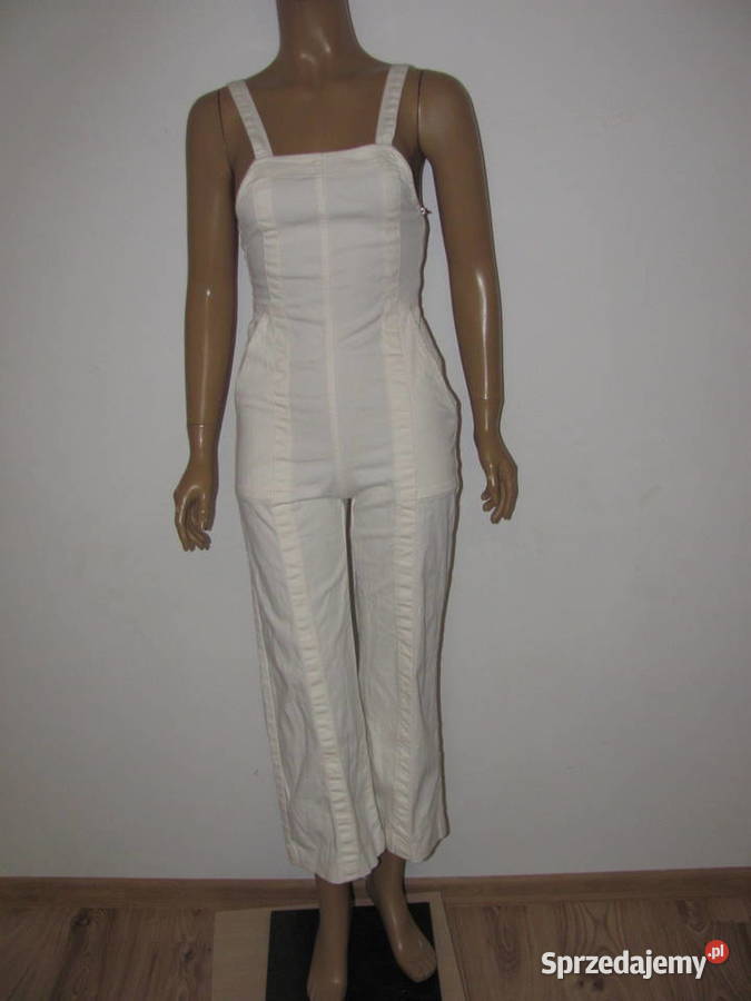 Kombinezon bez rękawów dzwony kremowe spodnie