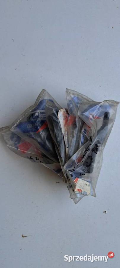 Sworzeń prawe mocowanie półki tylnej 7743043 osobowe Luzino