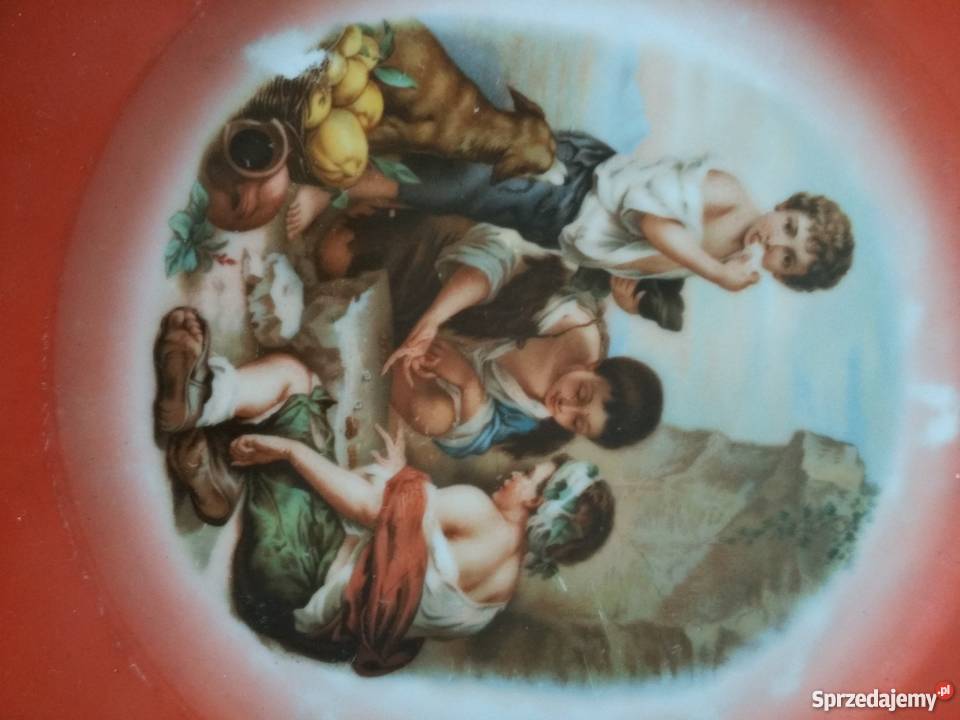 Pomarańczowy sygnowany talerz z historyjką sprzedam