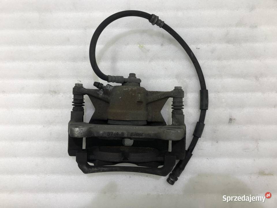 ZACISK LEWY PRZÓD VOLKSWAGEN TOURAN III