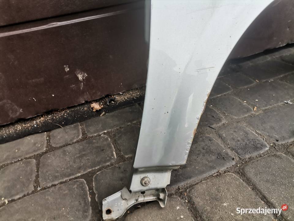 NISSAN PRIMERA P12 BŁOTNIK PRAWY PRZEDNI KY0G małopolskie Nowy Sącz