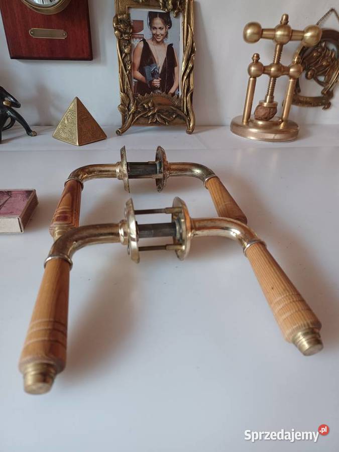 Dwa komplety klamek Mosiądz drewno Poznań