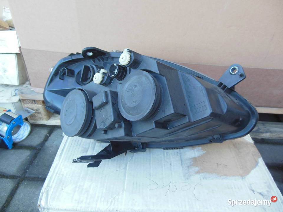 27053300 reflektor lancia mussa 2010 lewy przód Kozy