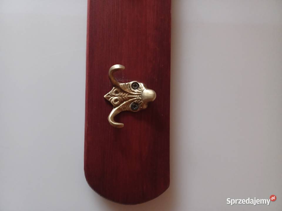 Mosiężne masywne piękne wieszaki na desce Poznań