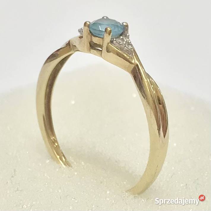 Złoty pierścionek 9K 375 z błękitnym topazem i mazowieckie