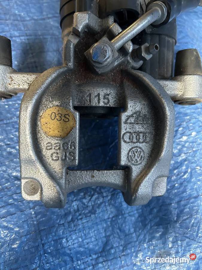 Vw Golf VII Zacisk Hamulcowy Tył Lewy 5Q0615405 osobowe