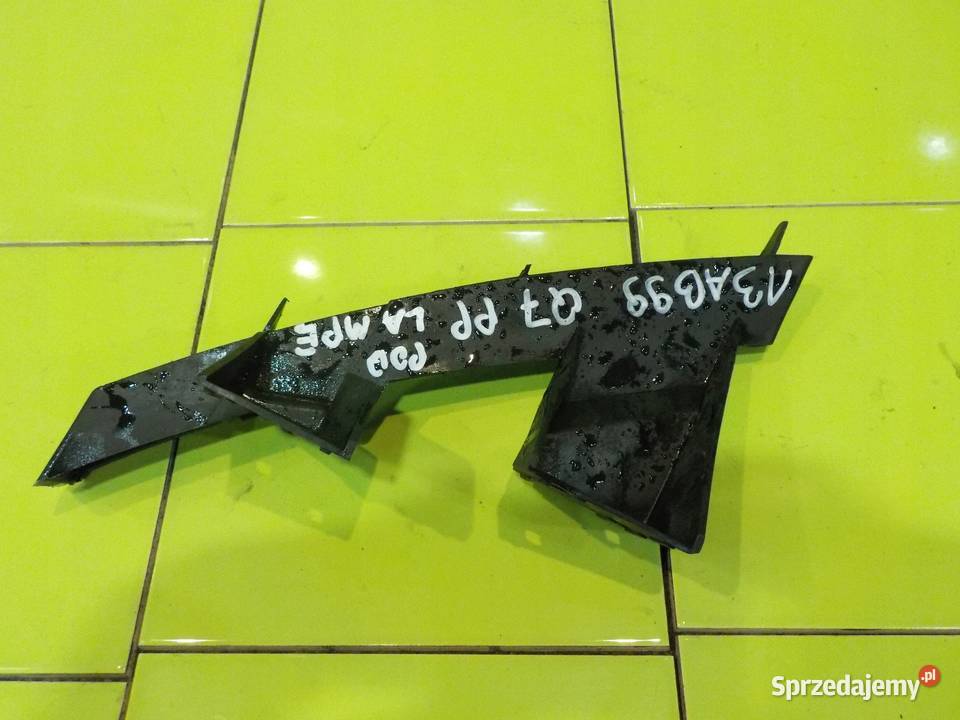 AUDI Q7 4L 30 TDI 07r slizg pod lampe prawy Zderzaki