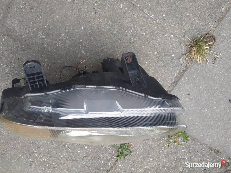 Suzuki Baleno 1998 1999 lampa lewa reflektor