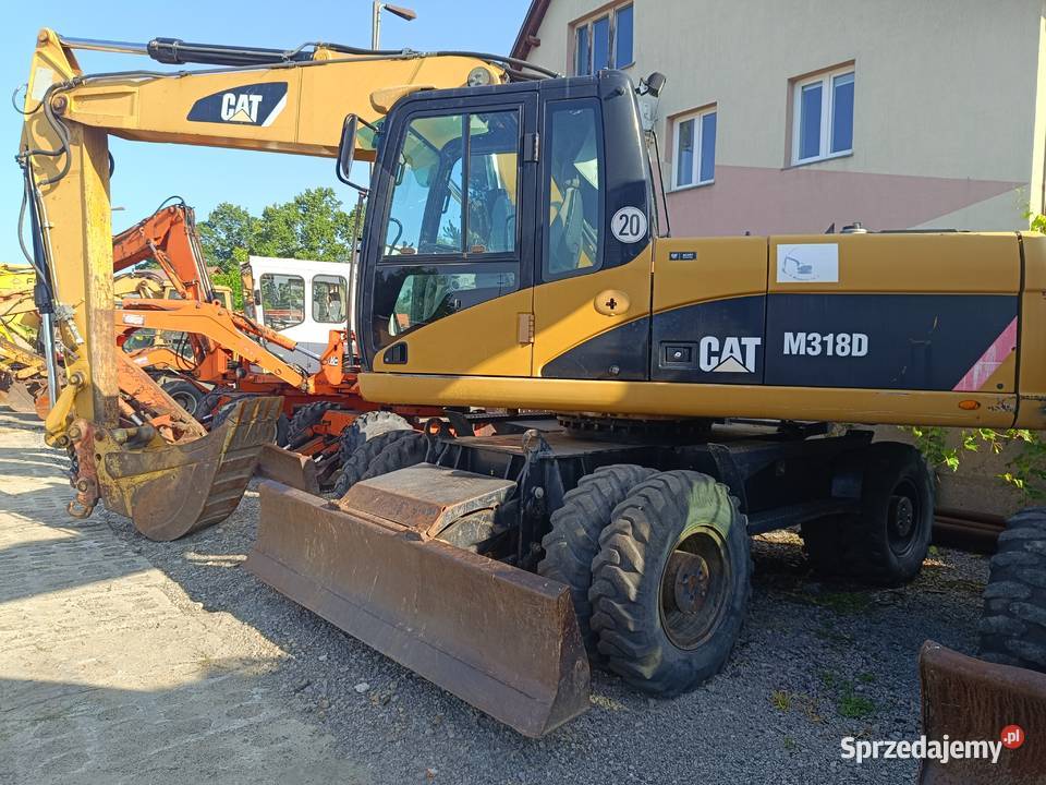 CAT M318D kołowa koparka produkcji 2009 Nisko