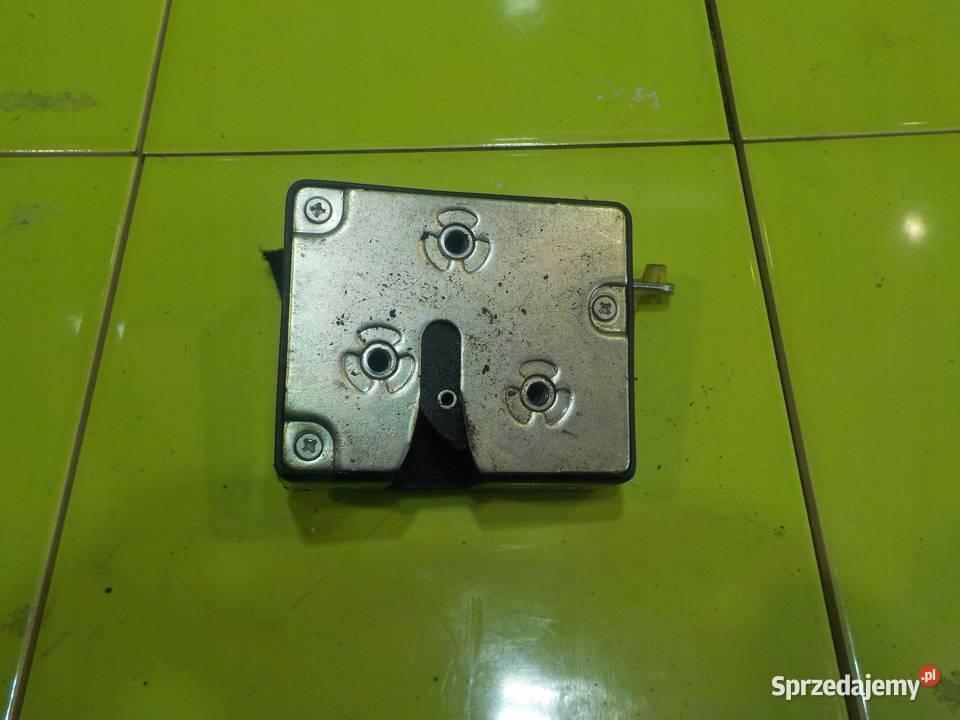 KIA CARNIVAL II 09r zamek klapy tyl osobowe Suków