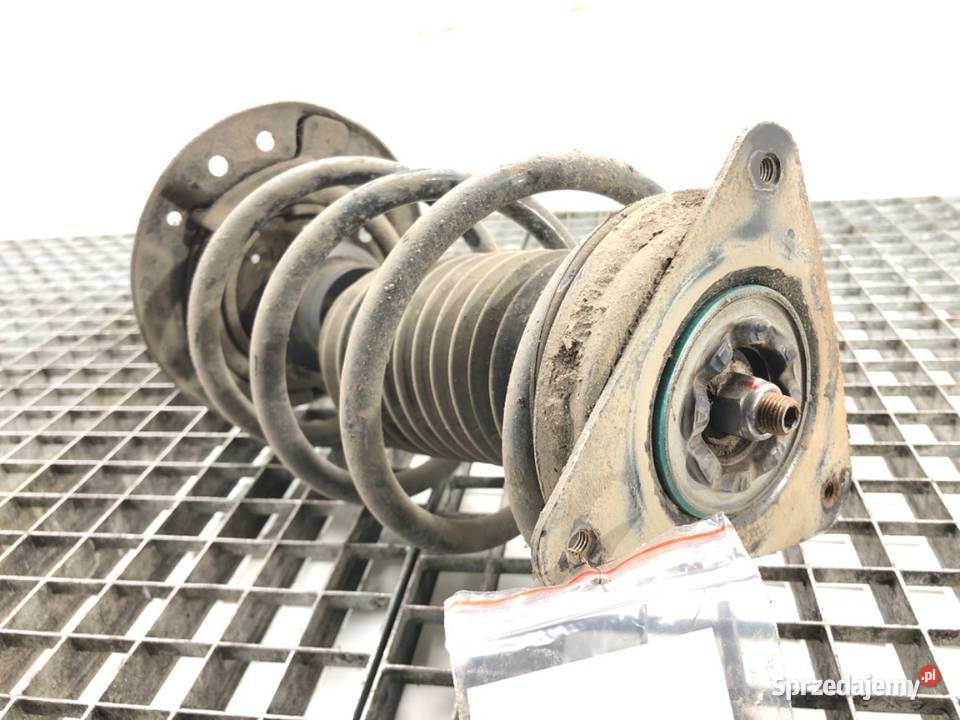 AMORTYZATOR LEWY PRZÓD ZE SPRĘŻYNĄ RENAULT