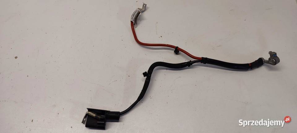 VW TIGUAN II KLEMA AKUMULATORA 5QA971228AH osobowe Materiały instalacyjne