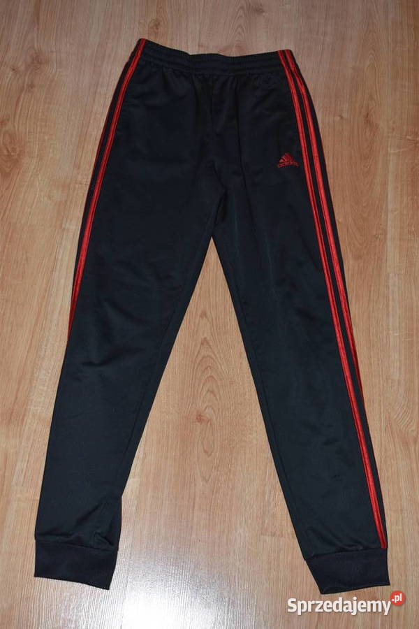 Klasyczne Spodnie Adidas z Czerwonymi Paskami sprzedam