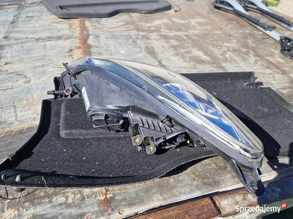 Opel Corsa D reflektor ORG EU Lampy przednie