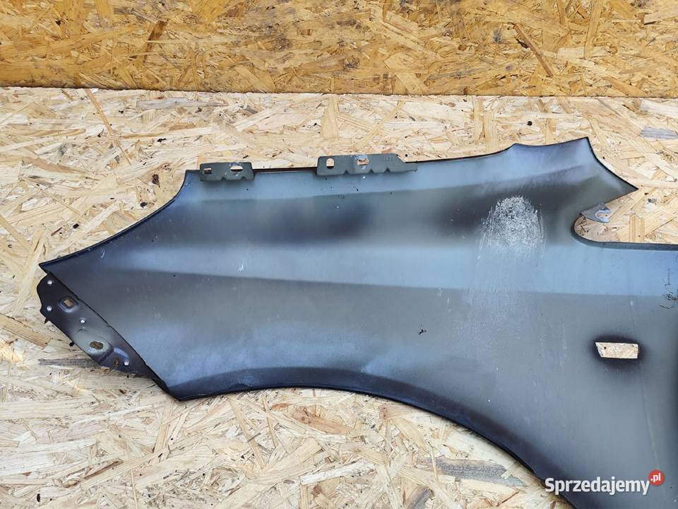 BŁOTNIK PRAWY PRZÓD PRZEDNI OPEL CORSA D 0611R Części samochodowe Przemęt