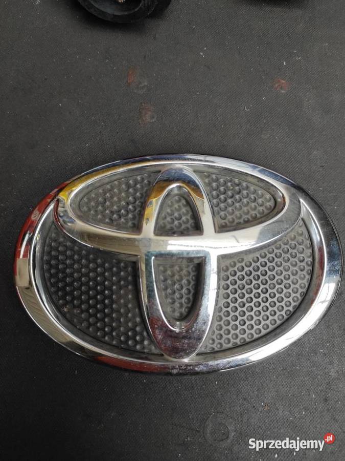 COROLLA VERSO II ZNACZEK EMBLEMAT ZDERZAKA PRZÓD Olsztyn
