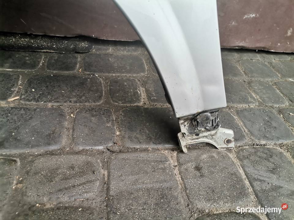 NISSAN PRIMERA P12 BŁOTNIK LEWY PRZEDNI KY0G Nowy Sącz