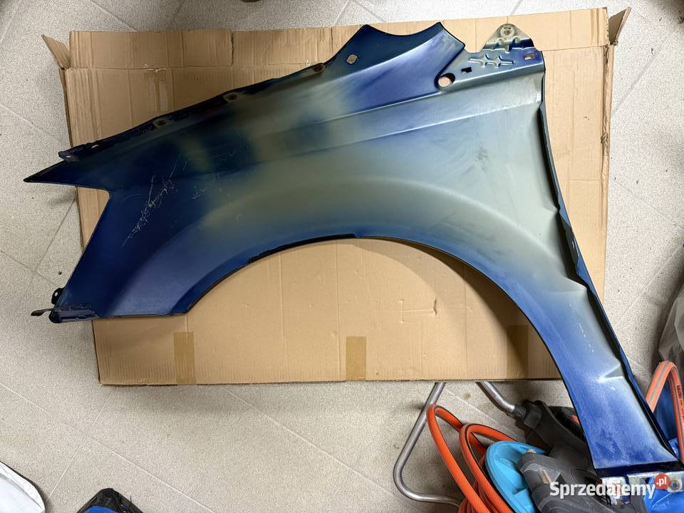 Błotnik prawy przód Dodge Grand Caravan oryginał osobowe podkarpackie