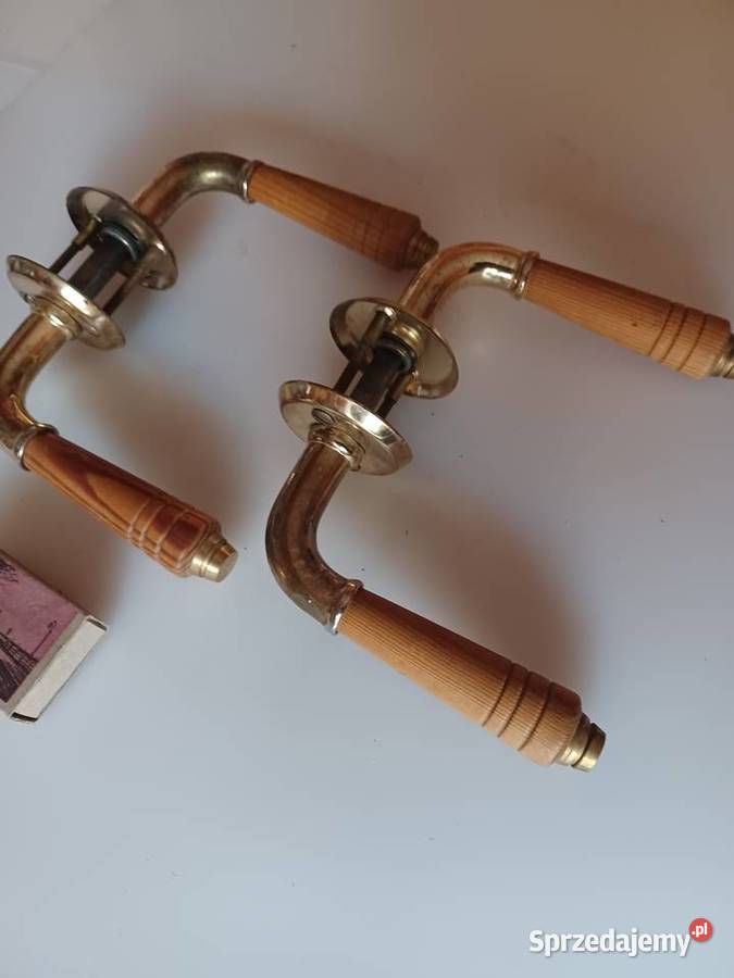 Dwa komplety klamek Mosiądz drewno Poznań