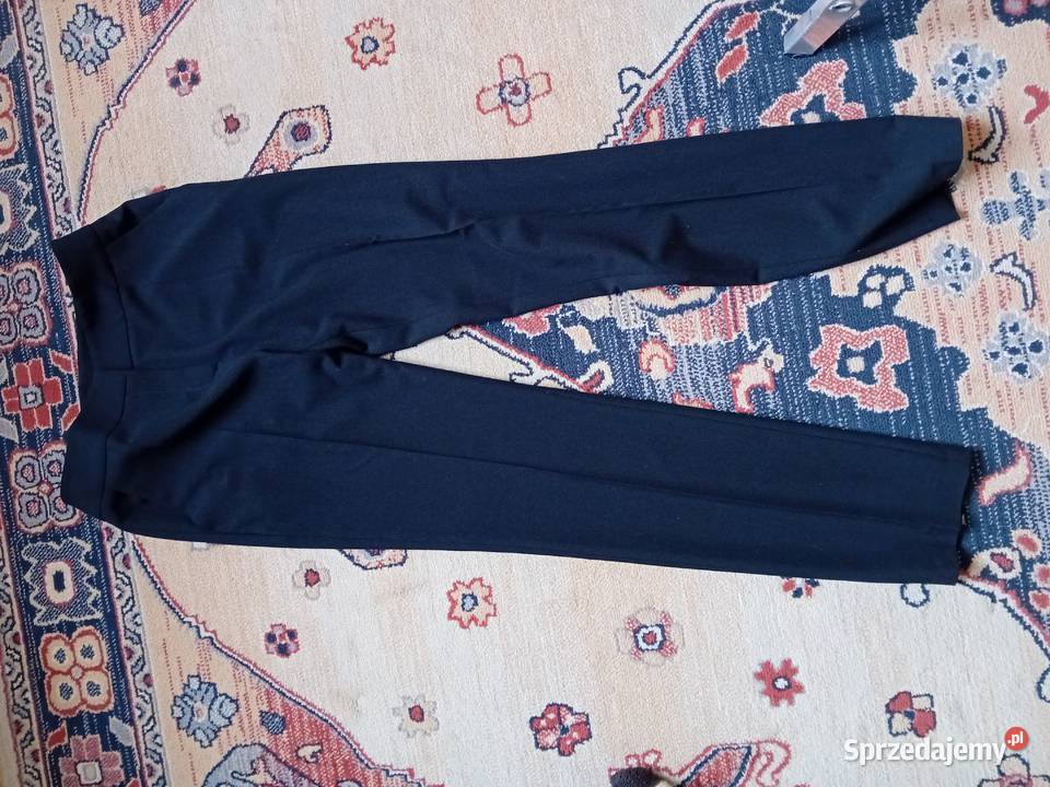 nieużywane eleganckie firmowe spodnie damskie Bez wzoru