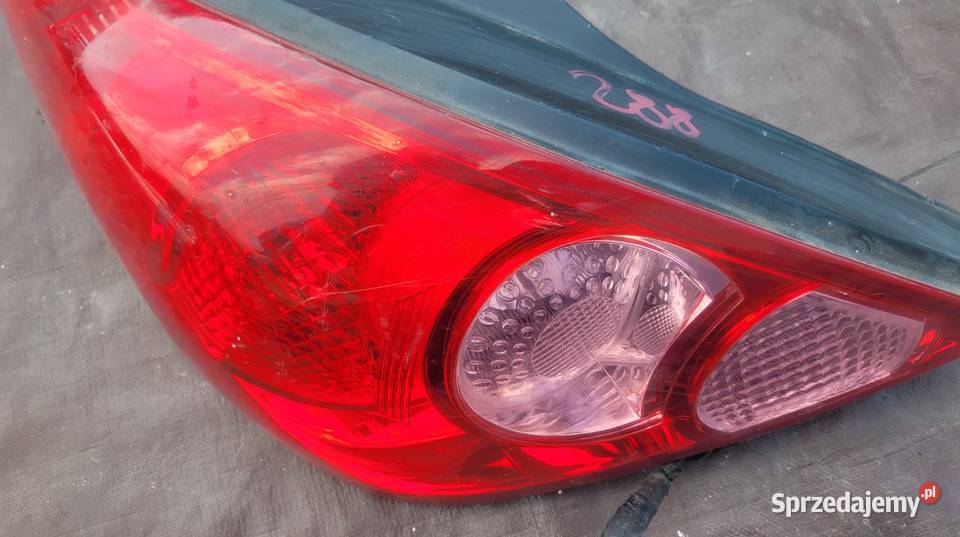 NISSAN TIIDA 5D LAMPA TYŁ LEWA 26555EM01A HELLA Ruda Śląska