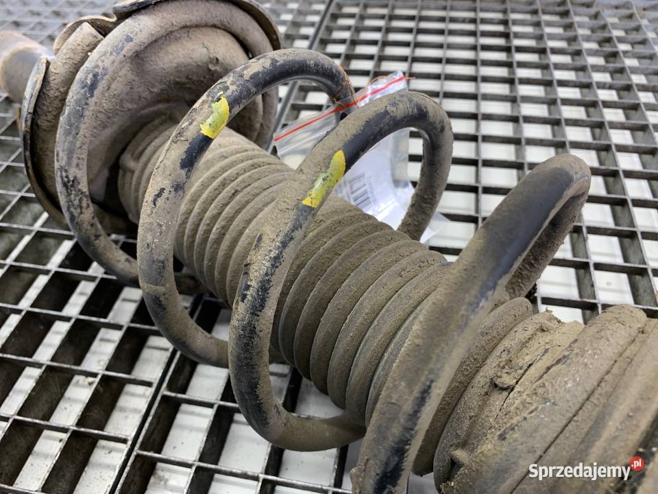 AMORTYZATOR LEWY PRZÓD ZE SPRĘŻYNĄ MAZDA 3 16