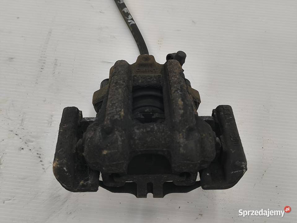 ZACISK LEWY TYŁ BMW F30 F31 20D LIFT