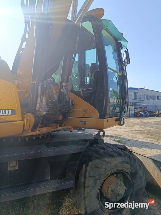 CAT M318D kołowa koparka produkcji 2009 Nisko